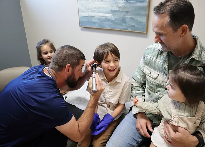 FNP-C Kyle Guillory with Family inside clinic